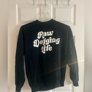 Medium sweatshirt, never worn, brand new, says “raw dogging life”